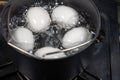 Boiling Eggs in Small Pot on Gas Stove Royalty Free Stock Photo