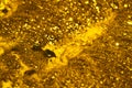 Boiling gold. Foam texture as background