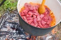 Boiling, hot goulash soup with meat, paprika, potatoes, onion, carrots is the traditional dish of Hungarian cuisine Royalty Free Stock Photo