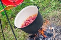 Boiling, hot goulash soup with meat, paprika, potatoes, onion, carrots is the traditional dish of Hungarian cuisine Royalty Free Stock Photo