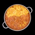 Boiling lentil soup in a large pan, isolated on black Royalty Free Stock Photo