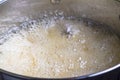 Boiling liquid in pot close up - Cooking caramel syrup at fast b