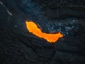 Boiling magma flowing through lava tubes under a layer of cooled lava, aerial