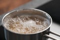 Boiling pasta in a saucepan on home kitchen Royalty Free Stock Photo