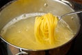 Boiling pasta spaghetti in pot. penne rigate pasta- Cooking pasta in boiling water Royalty Free Stock Photo