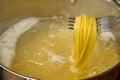 Boiling pasta spaghetti in pot. penne rigate pasta- Cooking pasta in boiling water Royalty Free Stock Photo