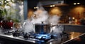 Boiling water in a cooking pot an pan on a induction stove in the modern kitchen Royalty Free Stock Photo