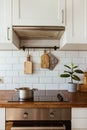 Boiling water in a cooking pot an a pan on a induction stove in the modern white kitchen Royalty Free Stock Photo