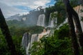Boiling water foam, crashing and falling jets, a fine mist over the water. The most high-water waterfall in the world - Iguazu. Royalty Free Stock Photo