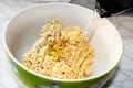 Boiling water from the kettle is filled with instant noodles in a Cup