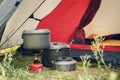 Boiling water in kettle on portable camping stove Royalty Free Stock Photo