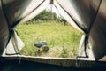 Boiling water in kettle on portable camping stove Royalty Free Stock Photo