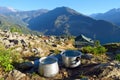 Big aluminum cooking pots surrounded in an amazing natural setting, Num, Nepal