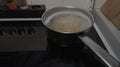Boiling water in a saucepan. Pasta is being cooked