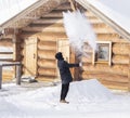 Boiling water splashed out of a mug in the cold minus 35 degrees turns into steam. a teenager explores the transformation of