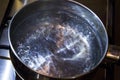 Boiling water in a steel casserole pot