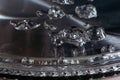 Boiling water in a teapot, water bubbles in macro Royalty Free Stock Photo