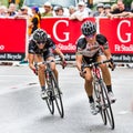 BOISE, IDAHO - JULY 14: Two racers go head to head around a corner at the Boise Twilight Criterium in Boise, Idaho on July 14 Royalty Free Stock Photo