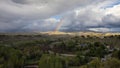 Boise Idaho neighborhood skyline with rainbow after rain during Summer. View from Camels Back Park Royalty Free Stock Photo