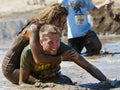 BOISE, IDAHO/USA - AUGUST 10: Unidentified couple horsing around in the mud pit near the finish at the The Dirty Dash in Boise, Id Royalty Free Stock Photo