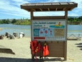 A life jacket loaning station for use on a lake in a park