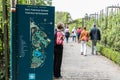 Boitsfort, Brussels Capital Region - Belgium - Sign of the Tournay-Solvay city park wwith people passing by