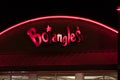 A Bojangles` sign is illuminated at night