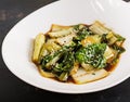 Bok choy vegetables stir fry with soy sauce and sesame seeds.