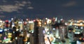 Bokeh abstract background of skyscraper buildings in Bangkok city, Thailand with lights, Blurry photo at night time. Cityscape Royalty Free Stock Photo