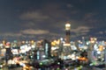 Bokeh abstract background of skyscraper buildings in Bangkok city, Thailand with lights, Blurry photo at night time. Cityscape Royalty Free Stock Photo