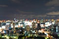 Bokeh abstract background of skyscraper buildings in Bangkok city, Thailand with lights, Blurry photo at night time. Cityscape Royalty Free Stock Photo