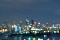 Bokeh abstract background of skyscraper buildings in Bangkok city, Thailand with lights, Blurry photo at night time. Cityscape Royalty Free Stock Photo