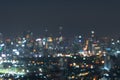 Bokeh abstract background of skyscraper buildings in Bangkok city, Thailand with lights, Blurry photo at night time. Cityscape Royalty Free Stock Photo