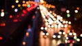 Bokeh abstract blurred background festive traffic yellow orange green red lights on road with sparkling circular animate motion 3D