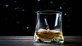 Whiskey in a glass on a black background with drops texture, an alcoholic drink in a glass, rum alcohol. Royalty Free Stock Photo