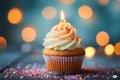 Bokeh background, birthday cupcake, burning candle, festive celebration delight