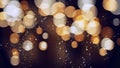 Bokeh background with golden glitter particles. Gold confetti with magic light. Luxury beautiful festive shining background. Glow