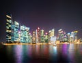 Bokeh background of skyscraper buildings in Singapore City Downtown with lights, Blurry photo at night time. Cityscape Royalty Free Stock Photo