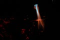 Bokeh of blue fire of a gas burner, burning coals and sparks on a black background in the dark Royalty Free Stock Photo