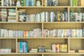 Bokeh blurry background of many book shelves library room in school or college. Abstract background for education concept Royalty Free Stock Photo