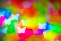 Bokeh butterfly colored lights on black background Royalty Free Stock Photo