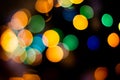 Bokeh christmas lights defocused on black background Royalty Free Stock Photo
