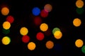 Bokeh christmas lights defocused on black background Royalty Free Stock Photo