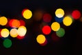 Bokeh christmas lights defocused on black background Royalty Free Stock Photo