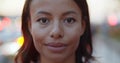 Bokeh close-up portrait of smiling woman on street. Royalty Free Stock Photo