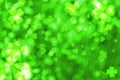 Bokeh effect with blurred clovers. St. Patrick's Day background Royalty Free Stock Photo