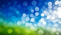A bokeh effect creates an abstract scene of floating white circles against blue and green gradients Royalty Free Stock Photo