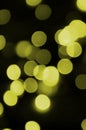 Bokeh effect golden yellow defocused light background. Christmas Lights Concept Royalty Free Stock Photo