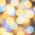 A bokeh effect image featuring overlapping circles of light in various colors, including Royalty Free Stock Photo