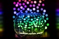 Bokeh and glass vase with drops on black background Royalty Free Stock Photo